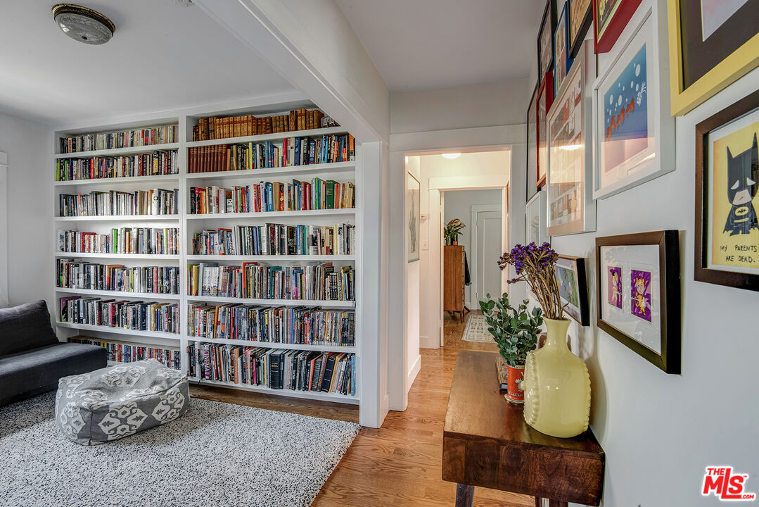 3828 Seneca Avenue Los Angeles, CA 90039 - Photo 13 of 40 a living room with furniture and a book shelf
