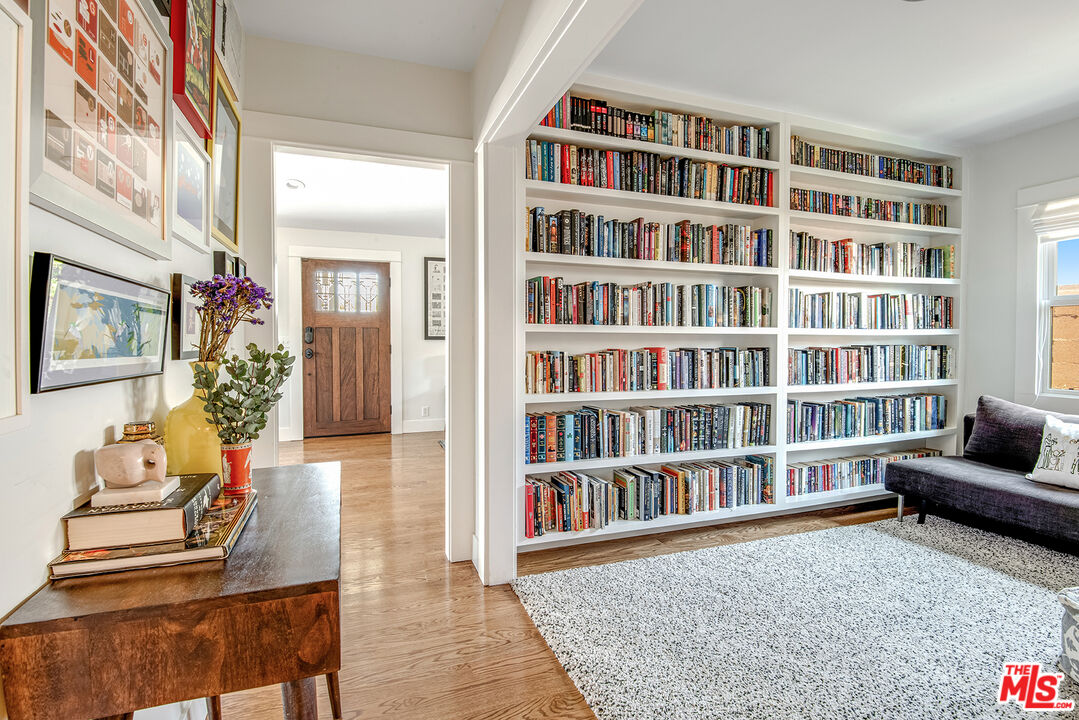 3828 Seneca Avenue Los Angeles, CA 90039 - Photo 16 of 40 a living room with furniture and a book shelf
