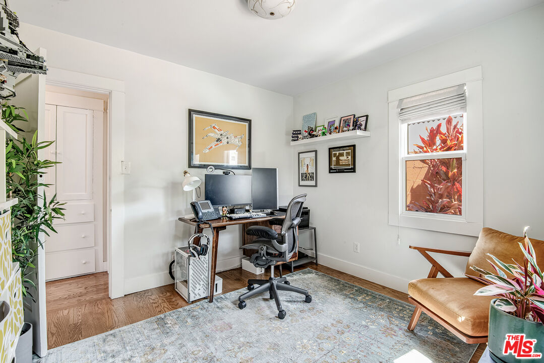 3828 Seneca Avenue Los Angeles, CA 90039 - Photo 21 of 40 a view of a workspace with furniture and a potted plant