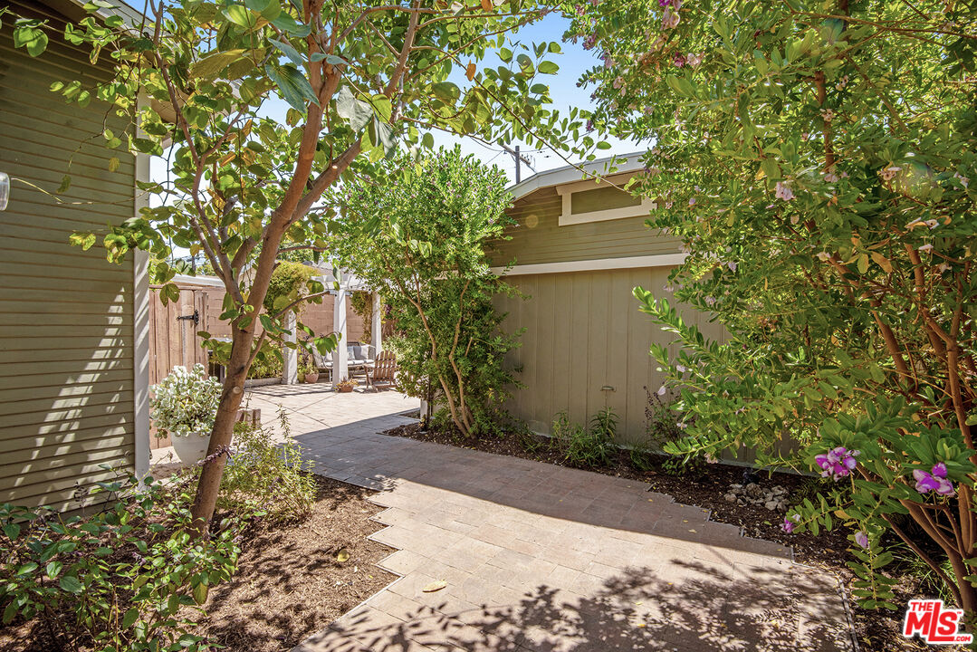 3828 Seneca Avenue Los Angeles, CA 90039 - Photo 23 of 40 a pathway of a house with a yard