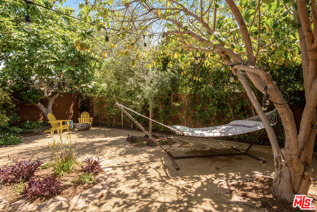 3828 Seneca Avenue Los Angeles, CA 90039 - Photo 35 of 40 a backyard of a house with table and chairs