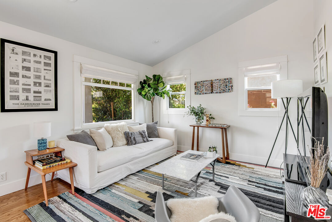 3828 Seneca Avenue Los Angeles, CA 90039 - Photo 6 of 40 a living room with furniture and a flat screen tv