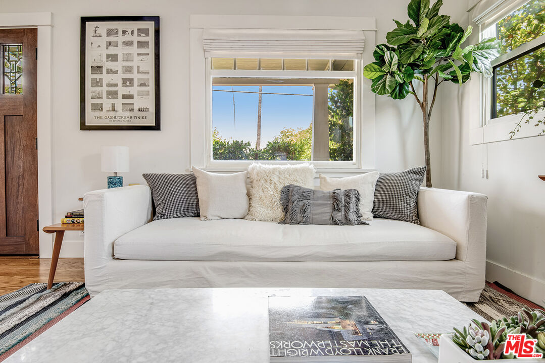 3828 Seneca Avenue Los Angeles, CA 90039 - Photo 8 of 40 a living room with furniture and a potted plant