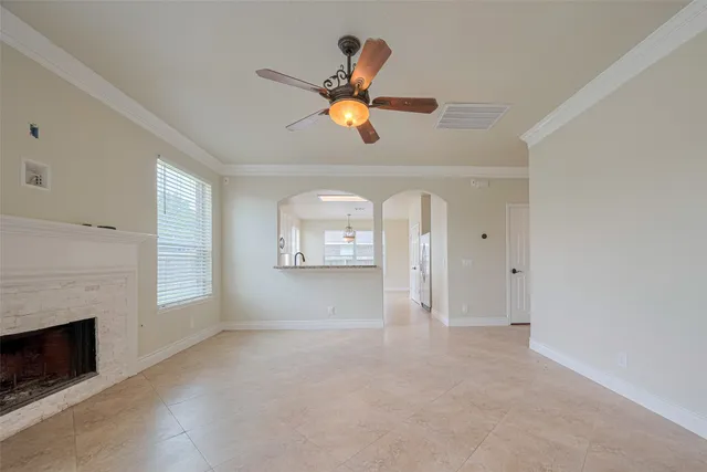a kitchen with granite countertop white cabinets stainless steel appliances and a sink