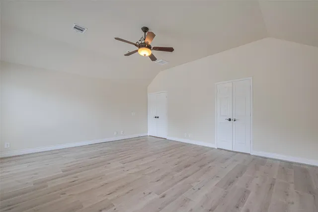 a bathroom with double sink and a mirror