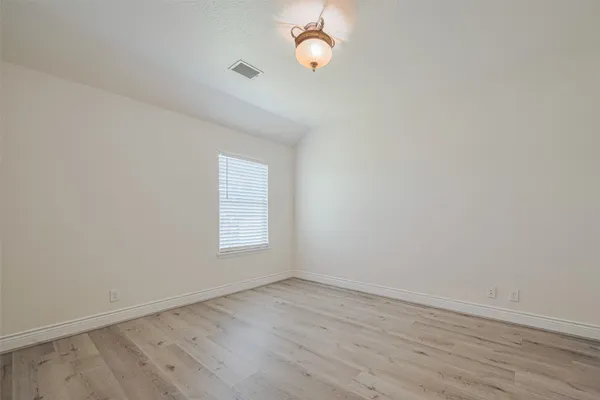 a bathroom with a sink vanity and a toilet