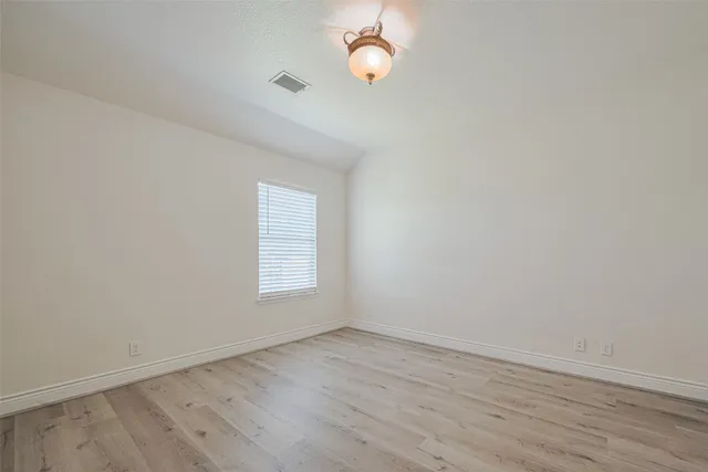 a bathroom with a sink vanity and a toilet