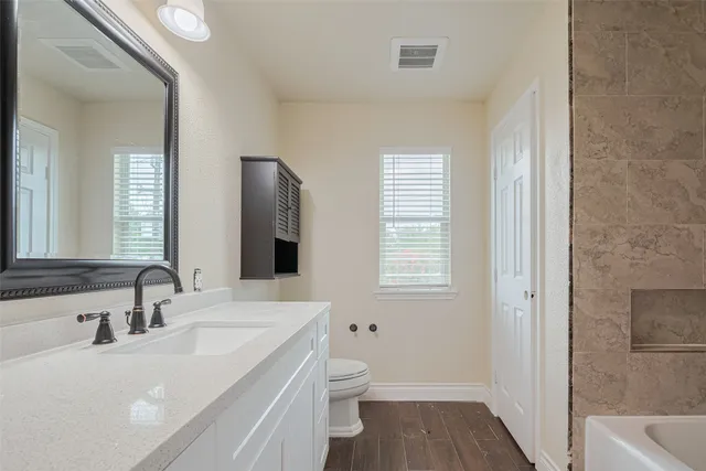 a view of a house with backyard and garden