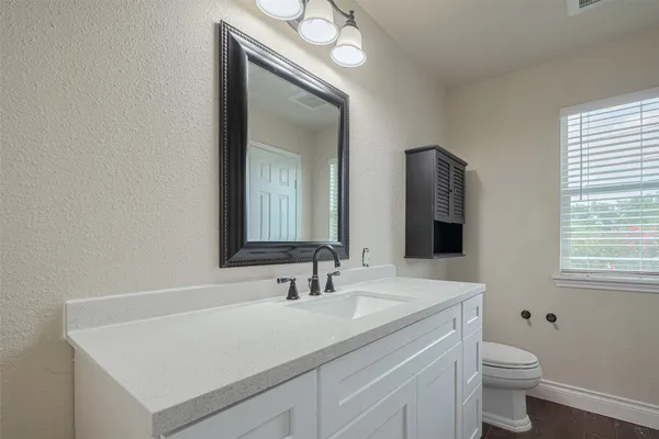 a view of yard with swimming pool and wooden fence