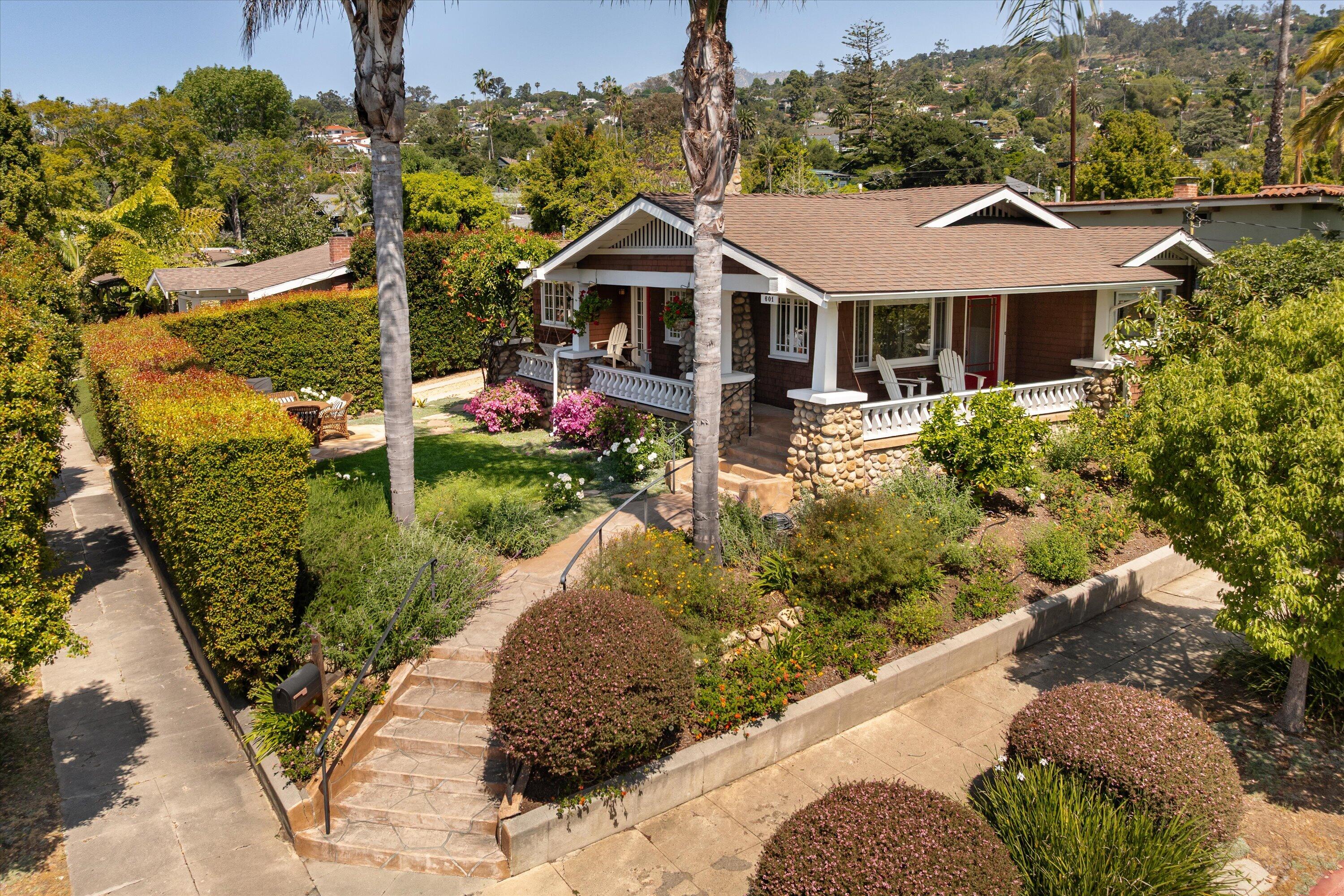 601 East Victoria Street Santa Barbara, CA 93103 - Photo 1 of 32 a front view of a house with garden