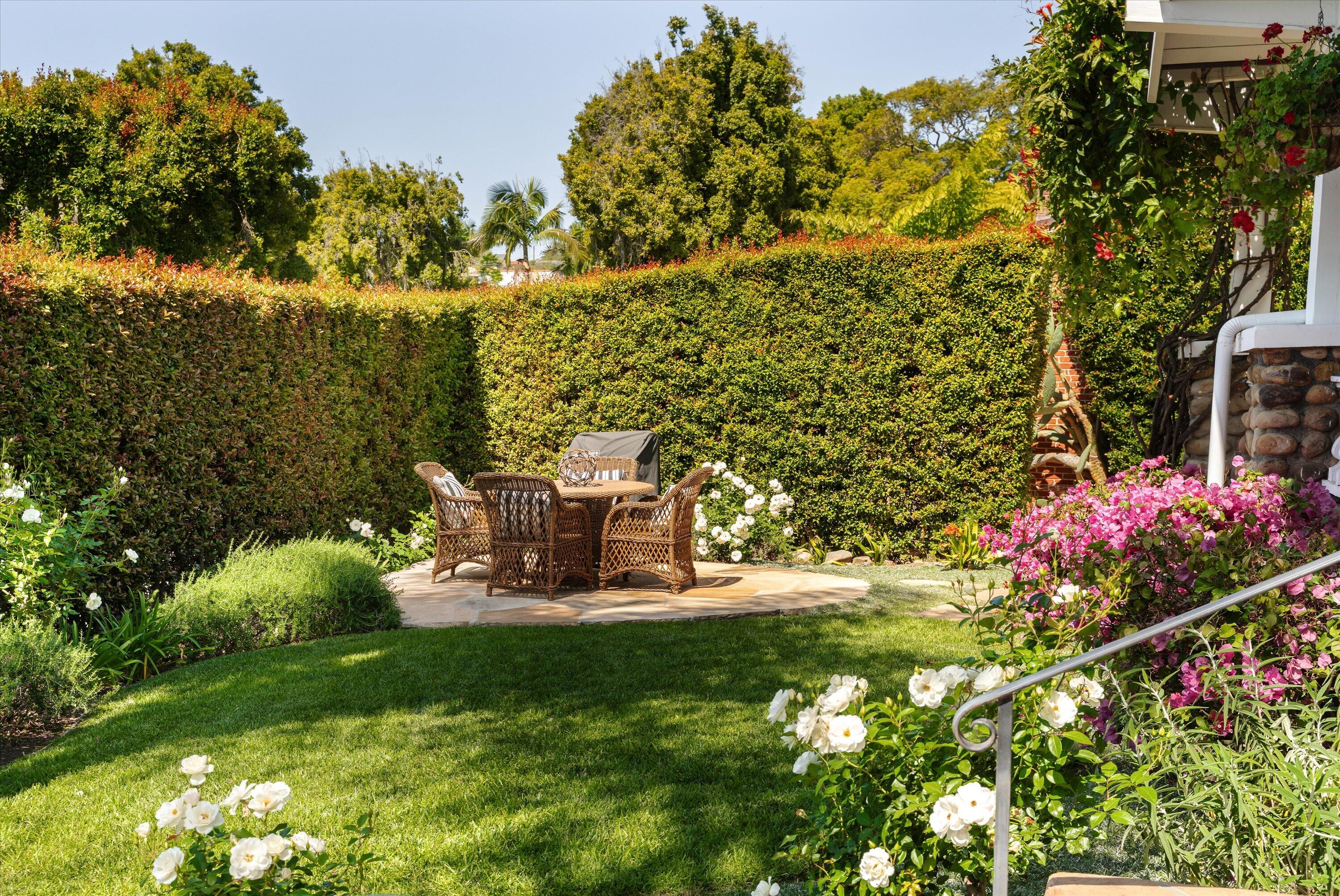 601 East Victoria Street Santa Barbara, CA 93103 - Photo 21 of 32 a view of a bench in backyard of the house