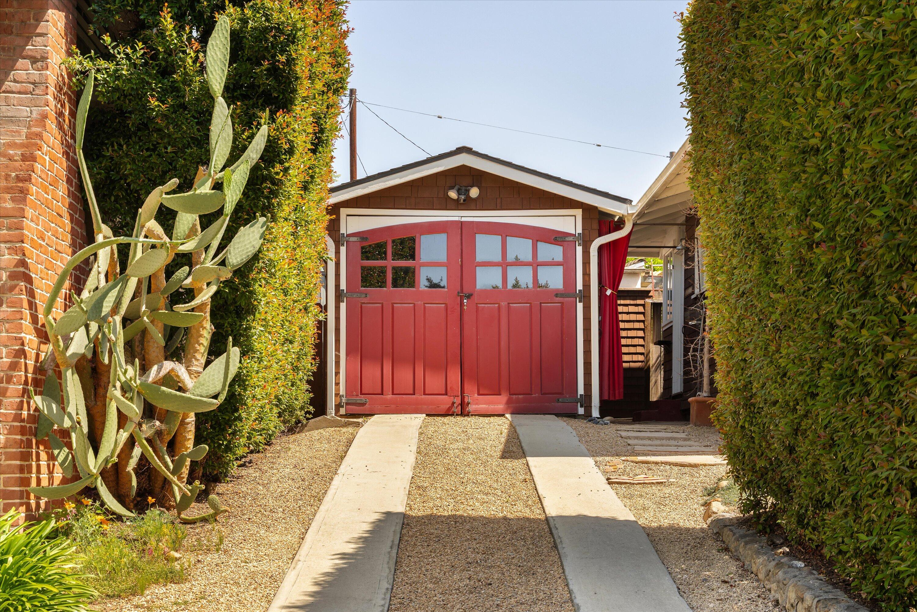 601 East Victoria Street Santa Barbara, CA 93103 - Photo 25 of 32 a view of a brick house with many windows and plants