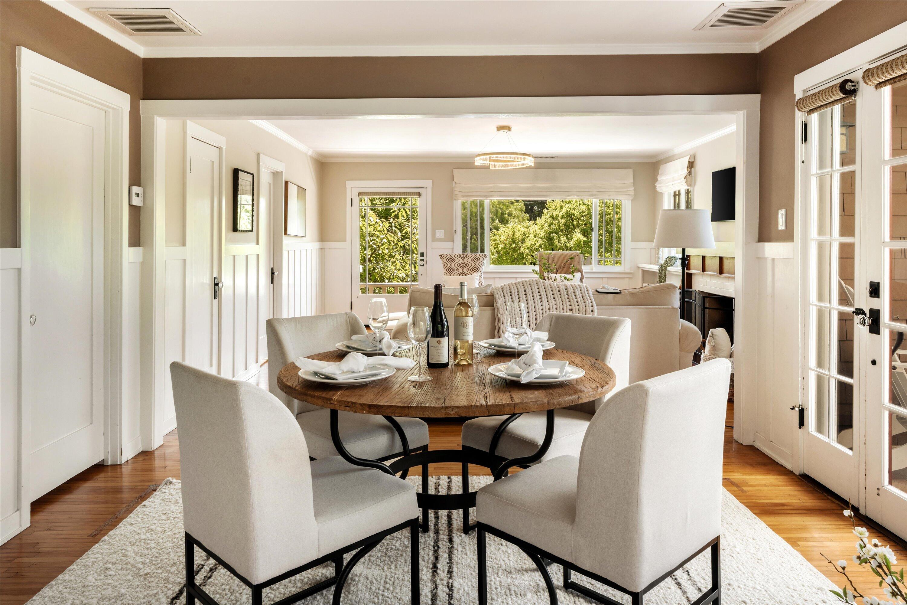 601 East Victoria Street Santa Barbara, CA 93103 - Photo 9 of 32 a view of a dining room with furniture window and wooden floor