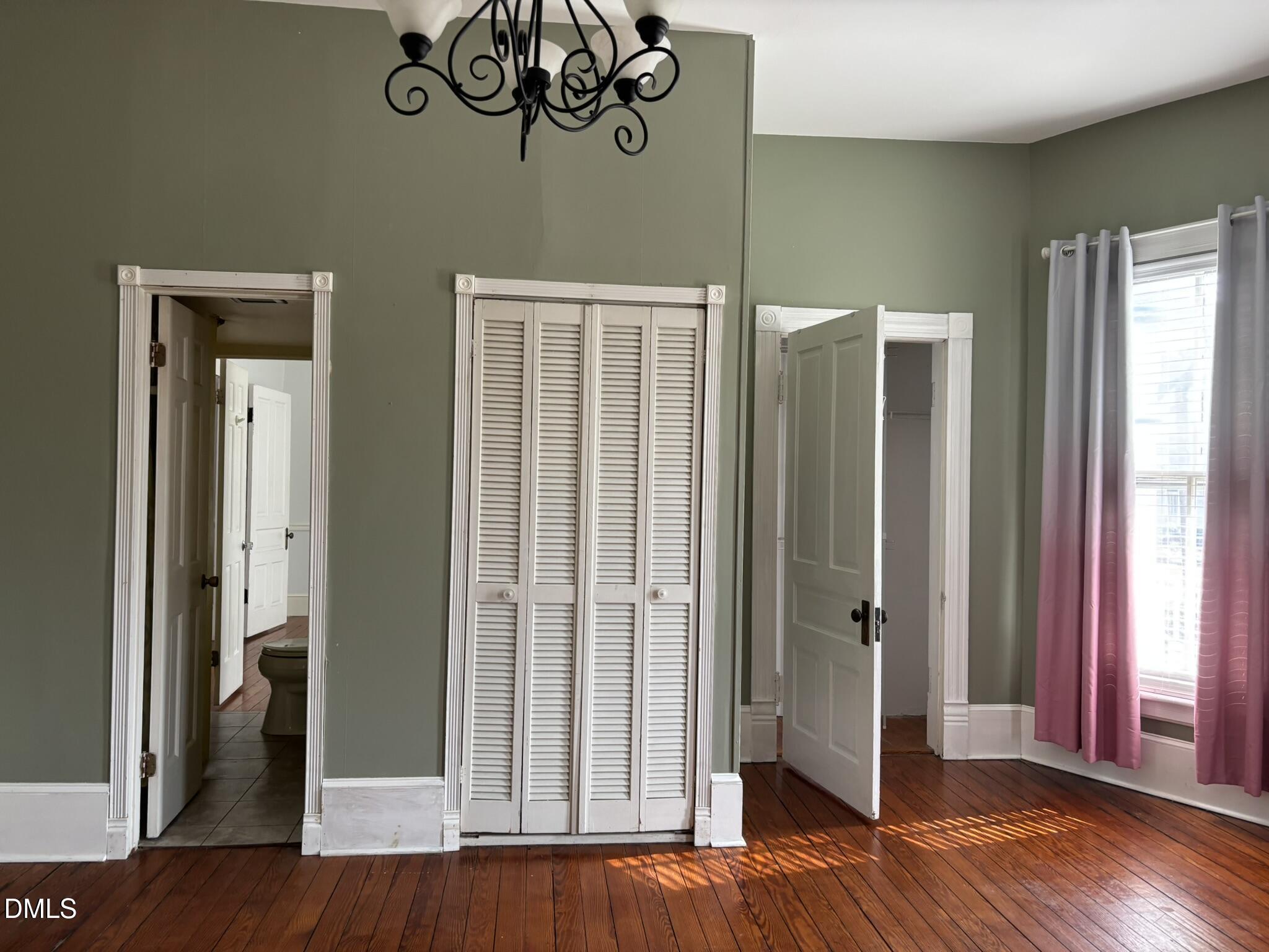 401 North Main Street Louisburg, NC 27549 - Photo 12 of 47 a view of a hallway with wooden floor and staircase