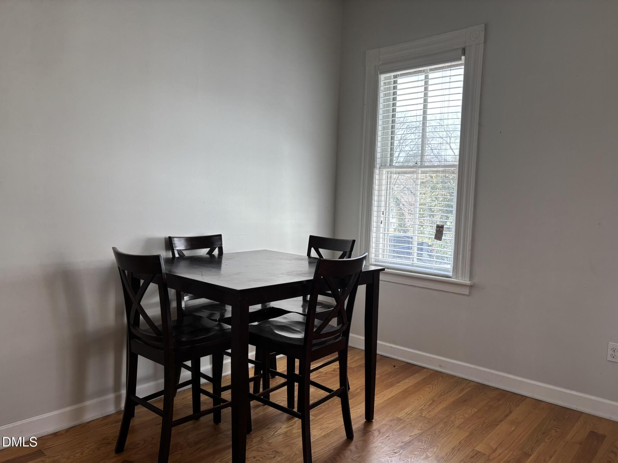 401 North Main Street Louisburg, NC 27549 - Photo 15 of 47 a view of a dining room with furniture and wooden floor