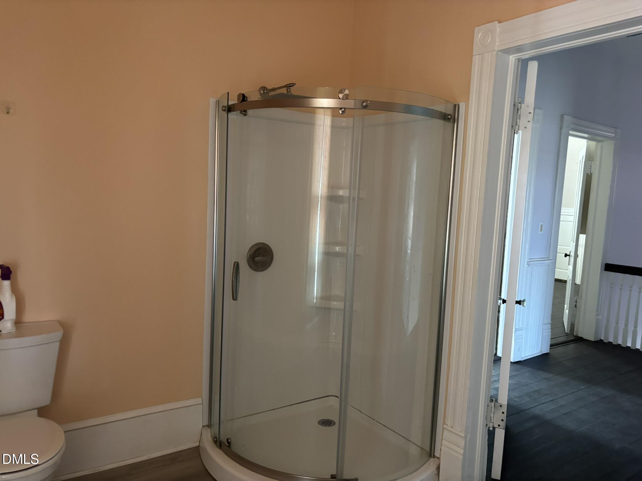 401 North Main Street Louisburg, NC 27549 - Photo 23 of 47 a bathroom with a shower a toilet and sink