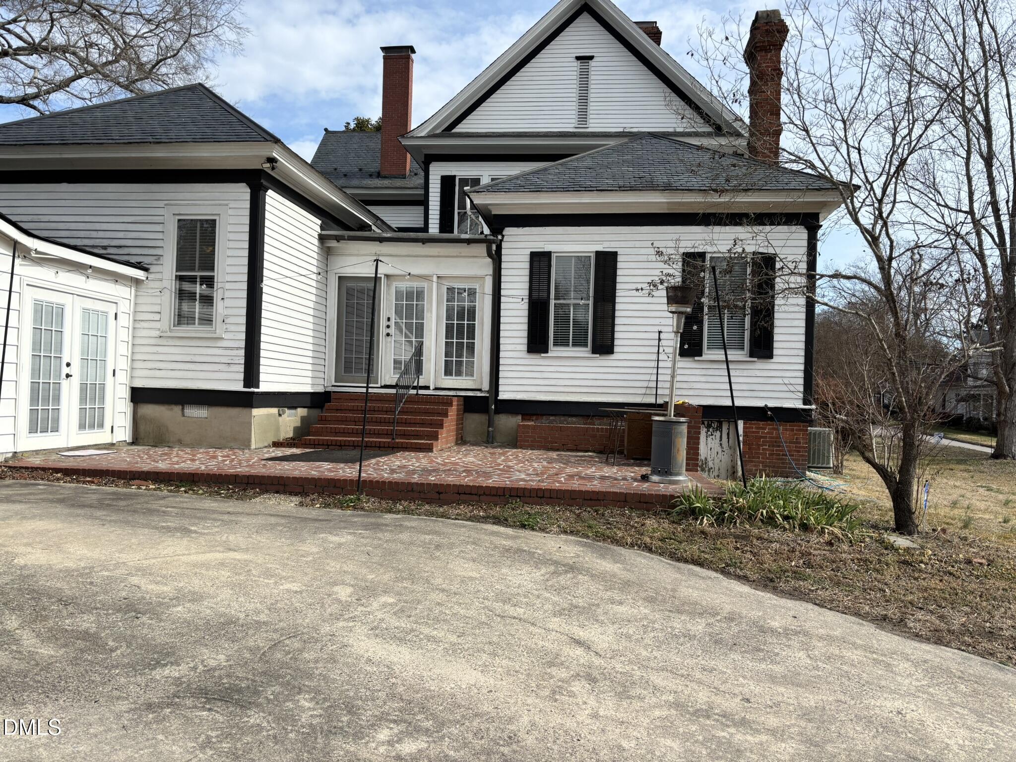 401 North Main Street Louisburg, NC 27549 - Photo 28 of 47 a front view of a house with garden