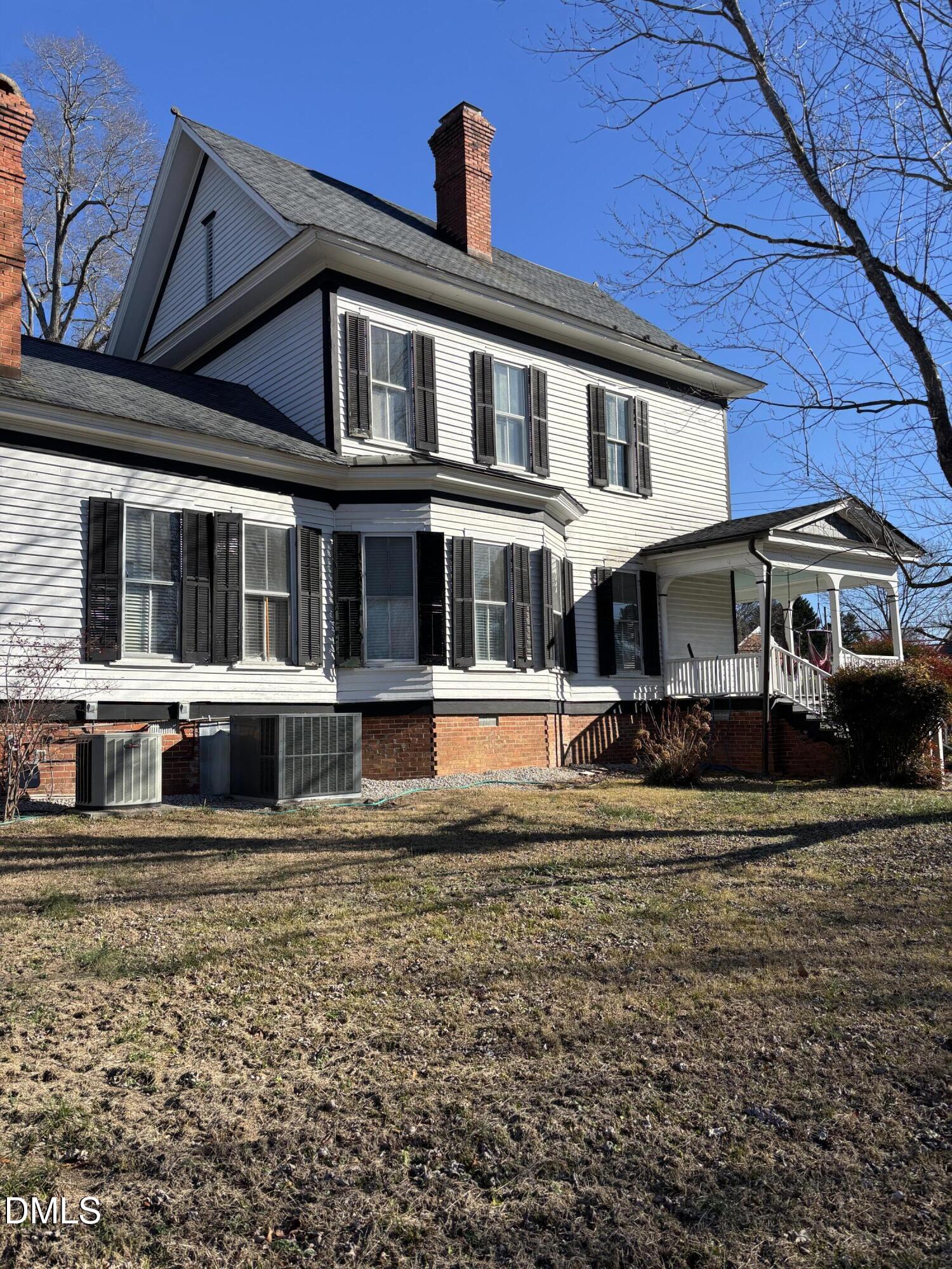 401 North Main Street Louisburg, NC 27549 - Photo 2 of 47 a front view of a house with a yard