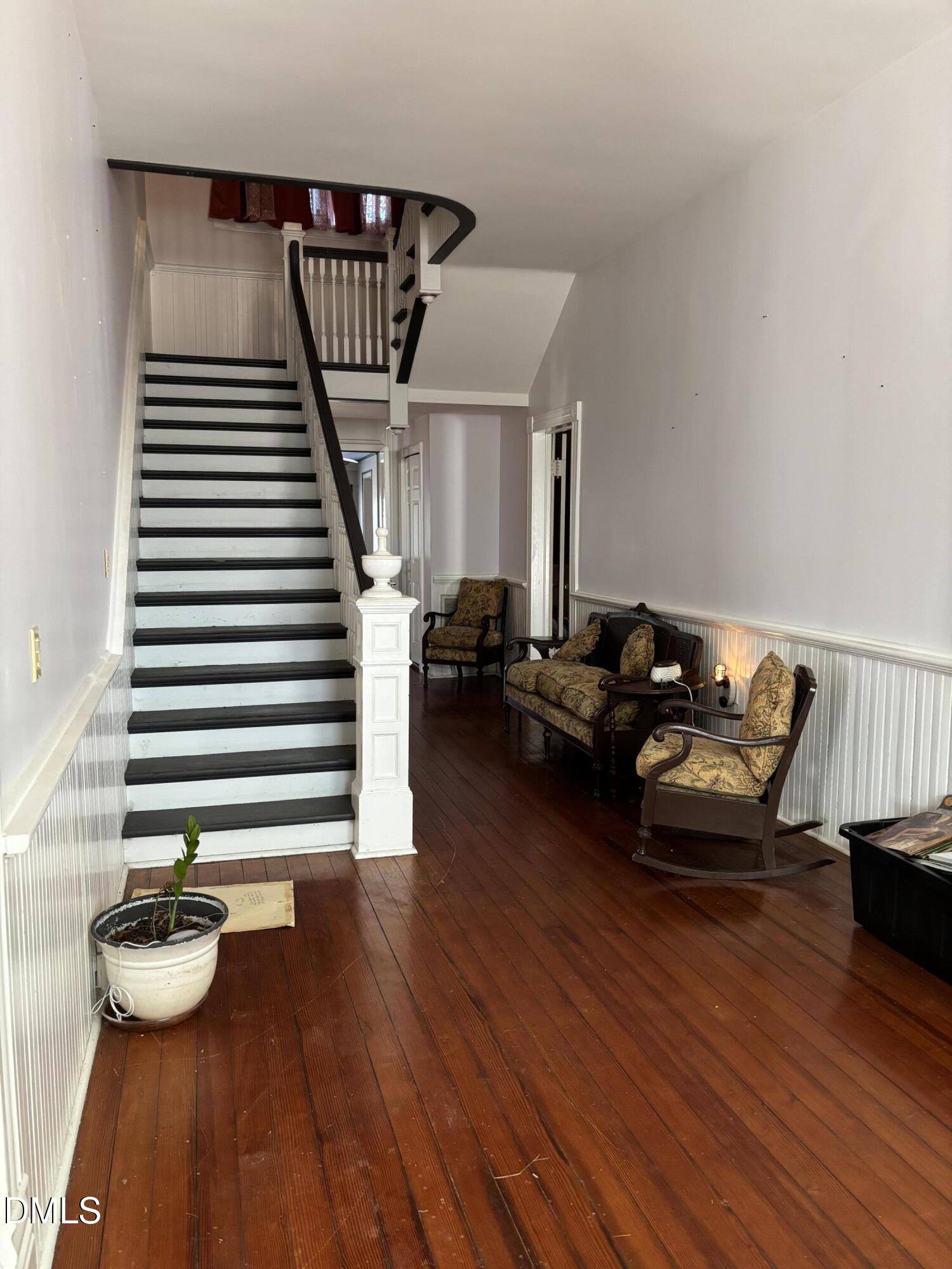 401 North Main Street Louisburg, NC 27549 - Photo 31 of 47 a living room with furniture and a wooden floor