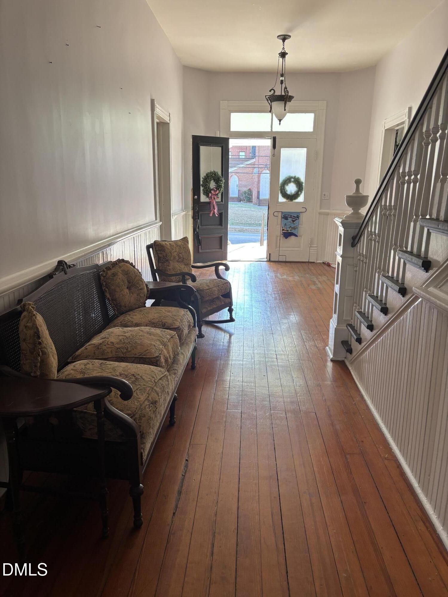 401 North Main Street Louisburg, NC 27549 - Photo 33 of 47 a living room with furniture and wooden floor