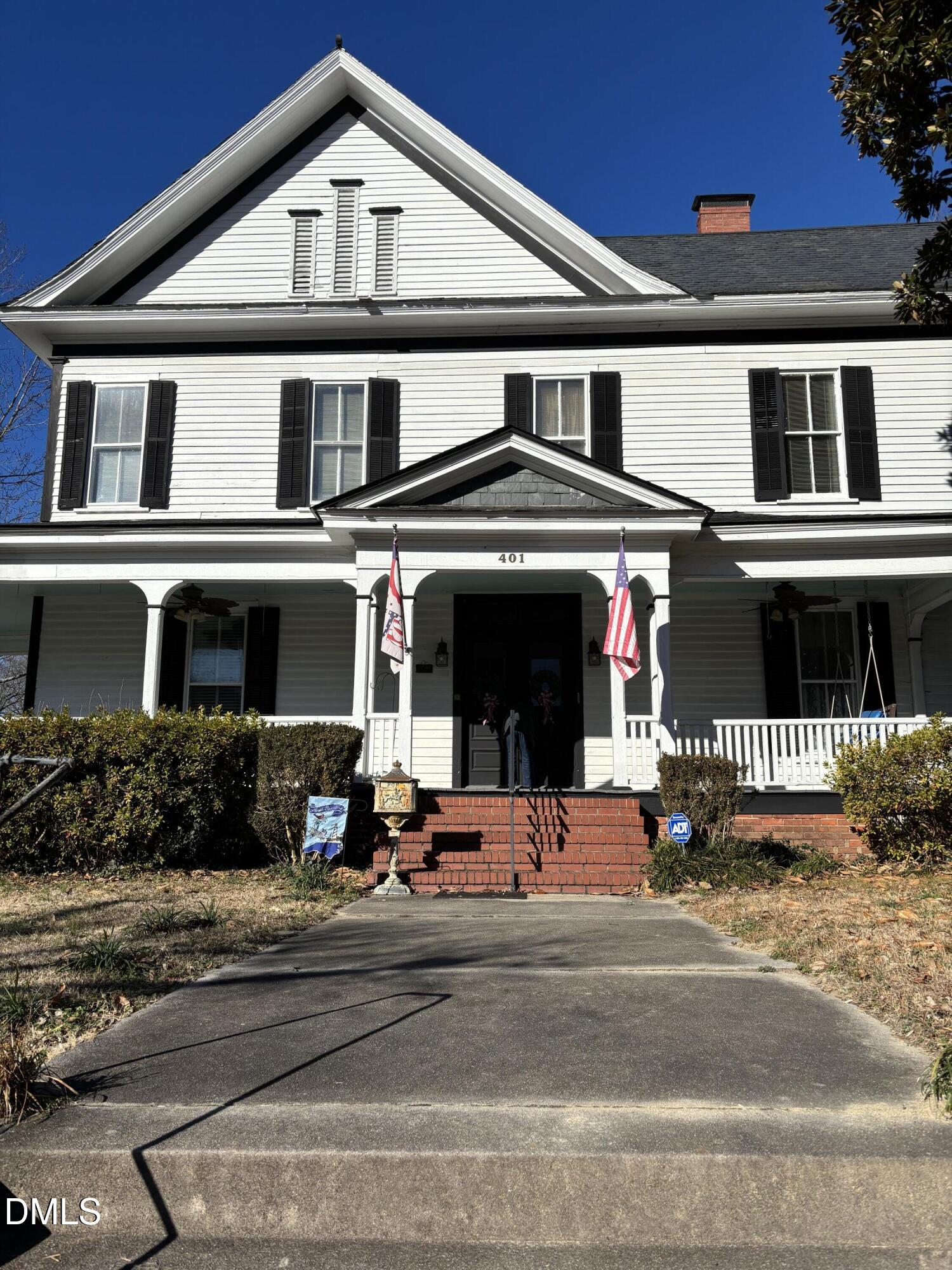 401 North Main Street Louisburg, NC 27549 - Photo 42 of 47 a front view of a house with a yard