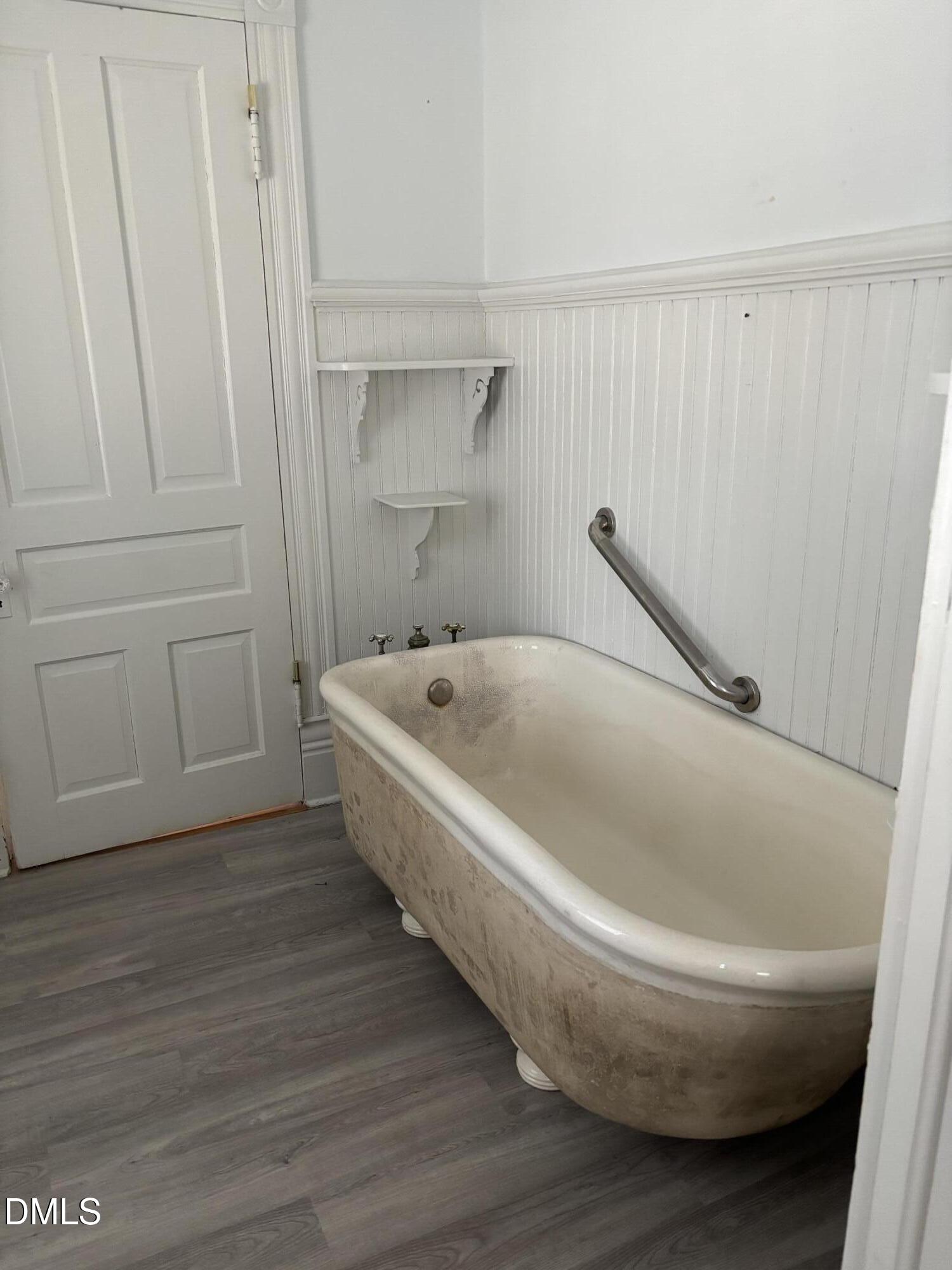 401 North Main Street Louisburg, NC 27549 - Photo 46 of 47 a white bath tub sitting in a bathroom