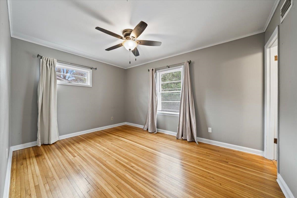 1073 Ivy Road Memphis, TN 38117 - Photo 16 of 33 a view of a livingroom with wooden floor and window