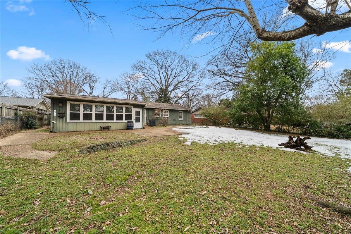 1073 Ivy Road Memphis, TN 38117 - Photo 23 of 33 a house view with swimming pool and trees in the background