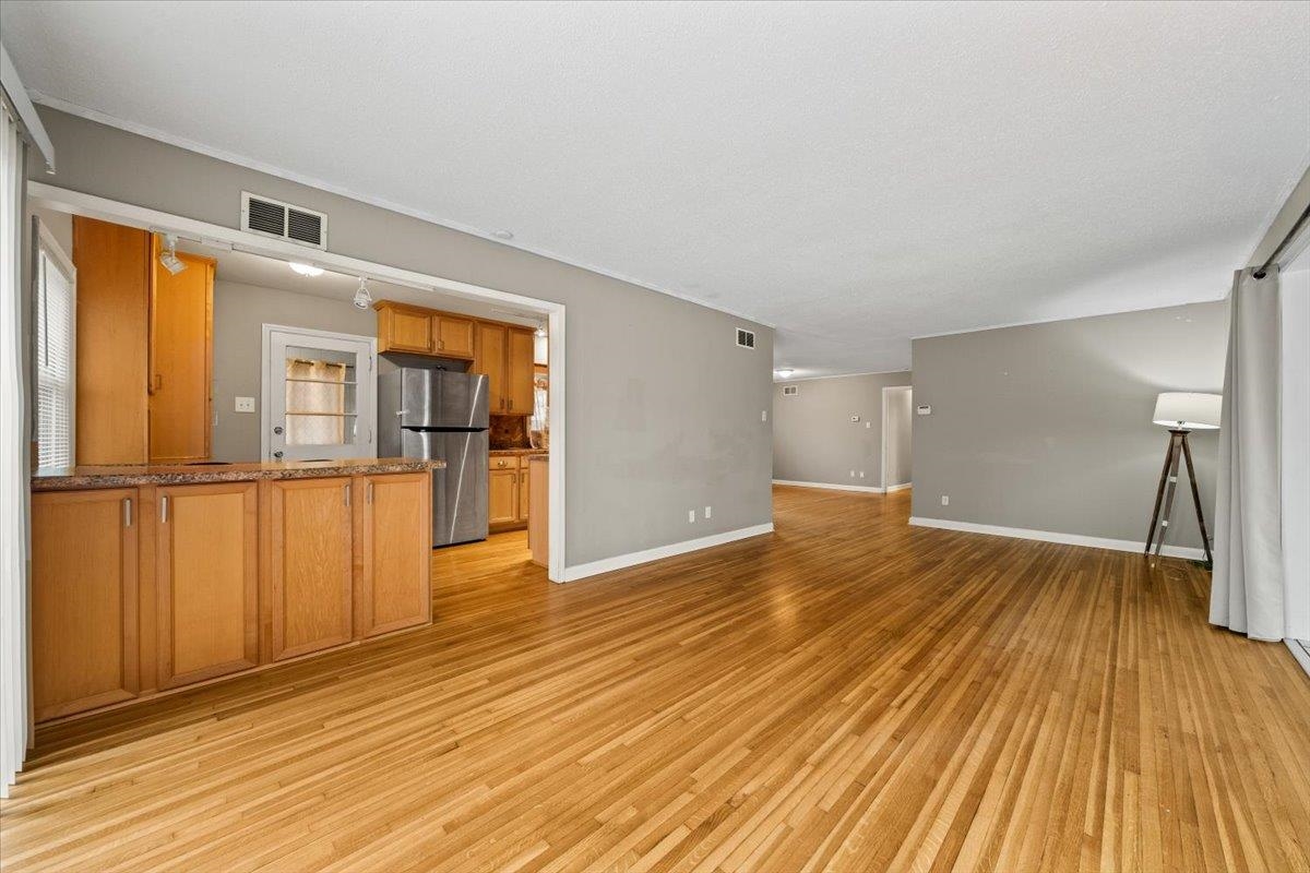 1073 Ivy Road Memphis, TN 38117 - Photo 8 of 33 a view of empty room with wooden floor