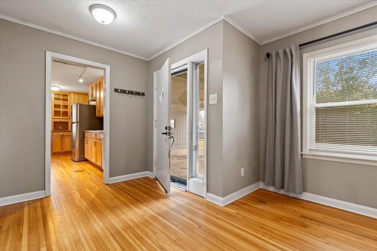 1073 Ivy Road Memphis, TN 38117 - Photo 9 of 33 a view of empty room with wooden floor and fan