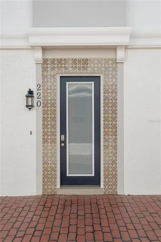 a view of a door and an empty room