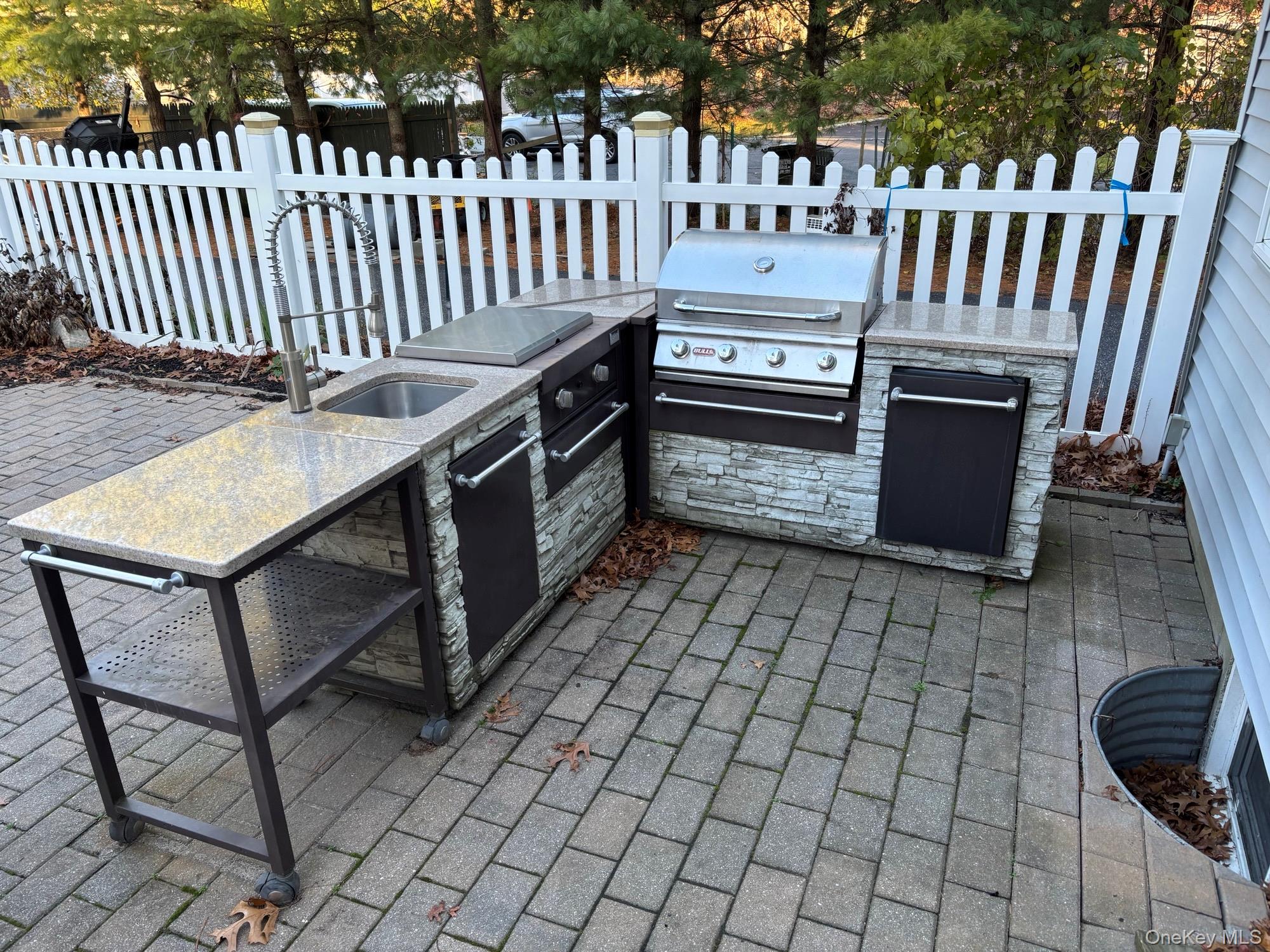 96 West Tiana Road Hampton Bays, NY 11946 - Photo 3 of 21 Outdoor BBQ, with gas grill, fridge & sink