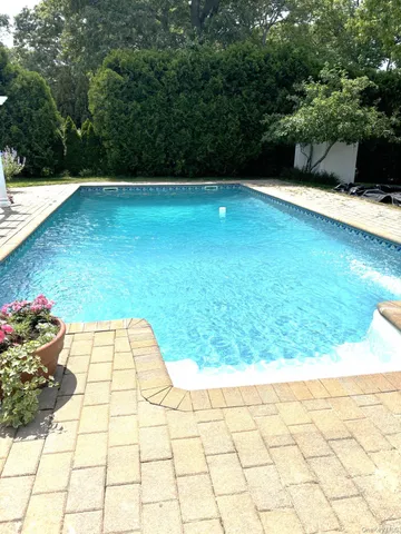 a view of swimming pool from a yard
