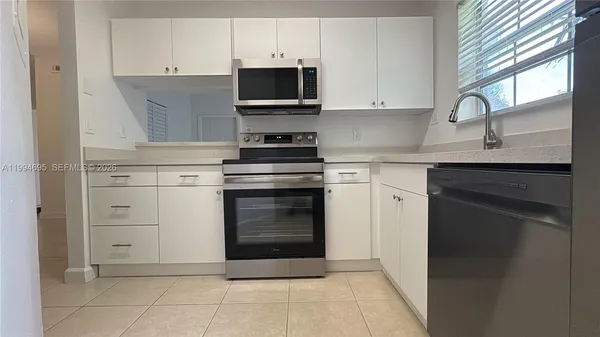 a kitchen with a sink and a window