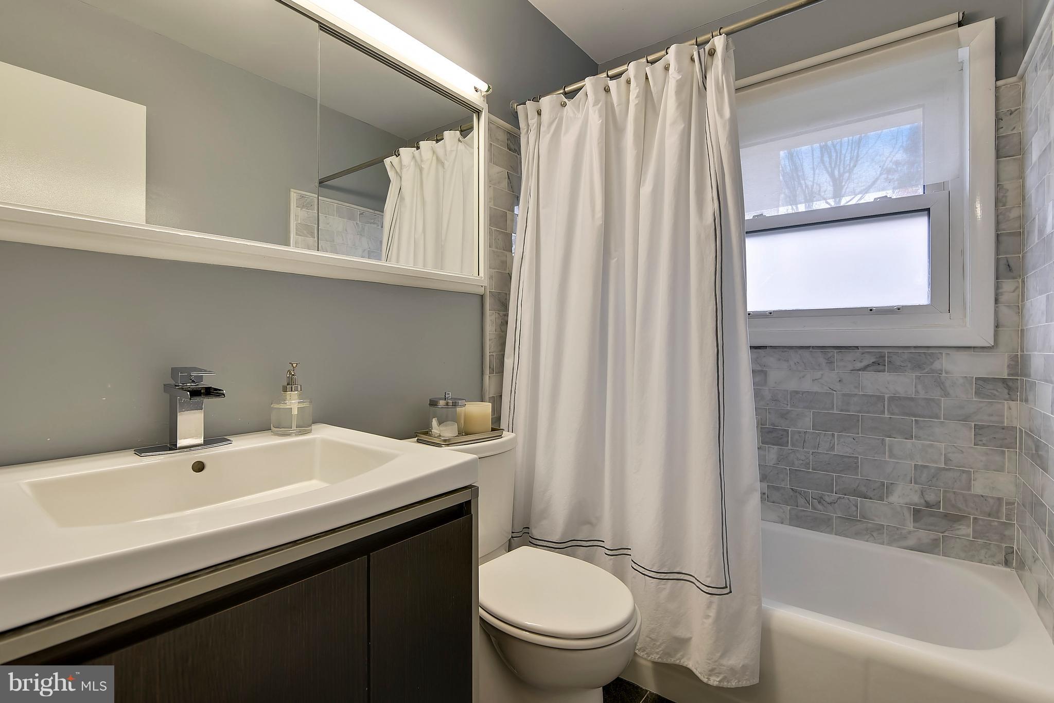 7512 Dunston Street Springfield, VA 22151 - Photo 14 of 25 Updated Bathroom w/Tub