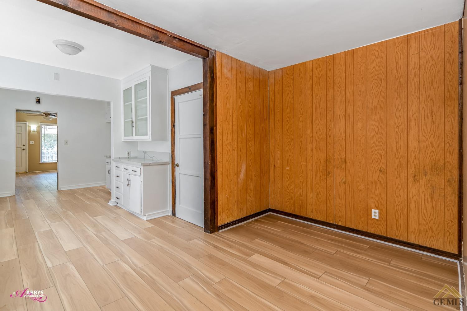 Undisclosed Address Bakersfield, CA 93308 - Photo 18 of 37 a view of empty room with wooden floor
