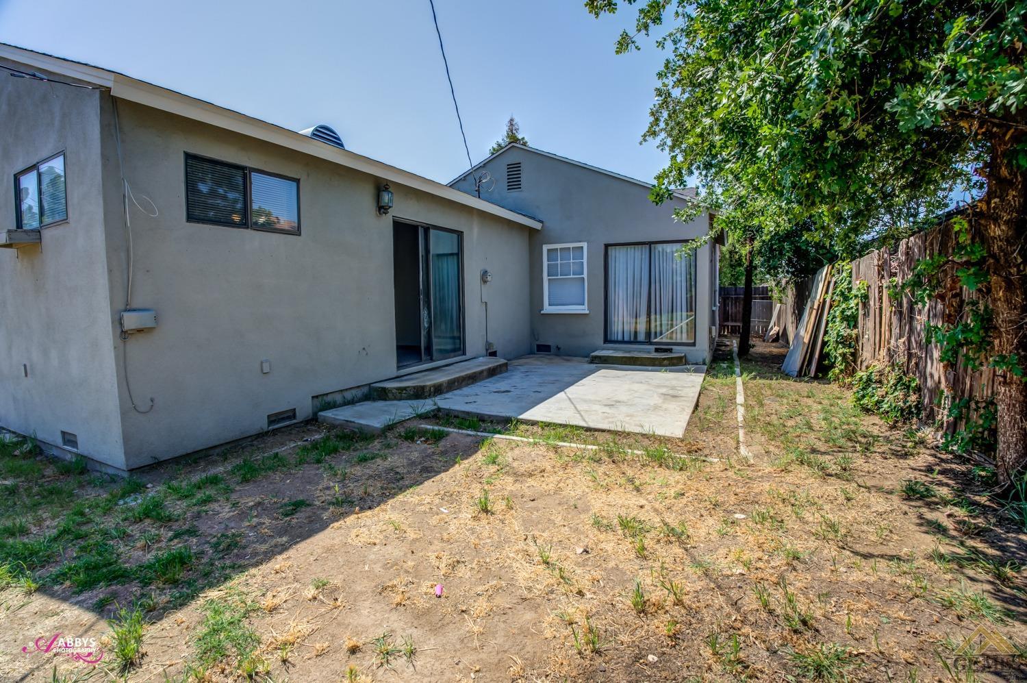 Undisclosed Address Bakersfield, CA 93308 - Photo 30 of 37 a view of a house with backyard and trees