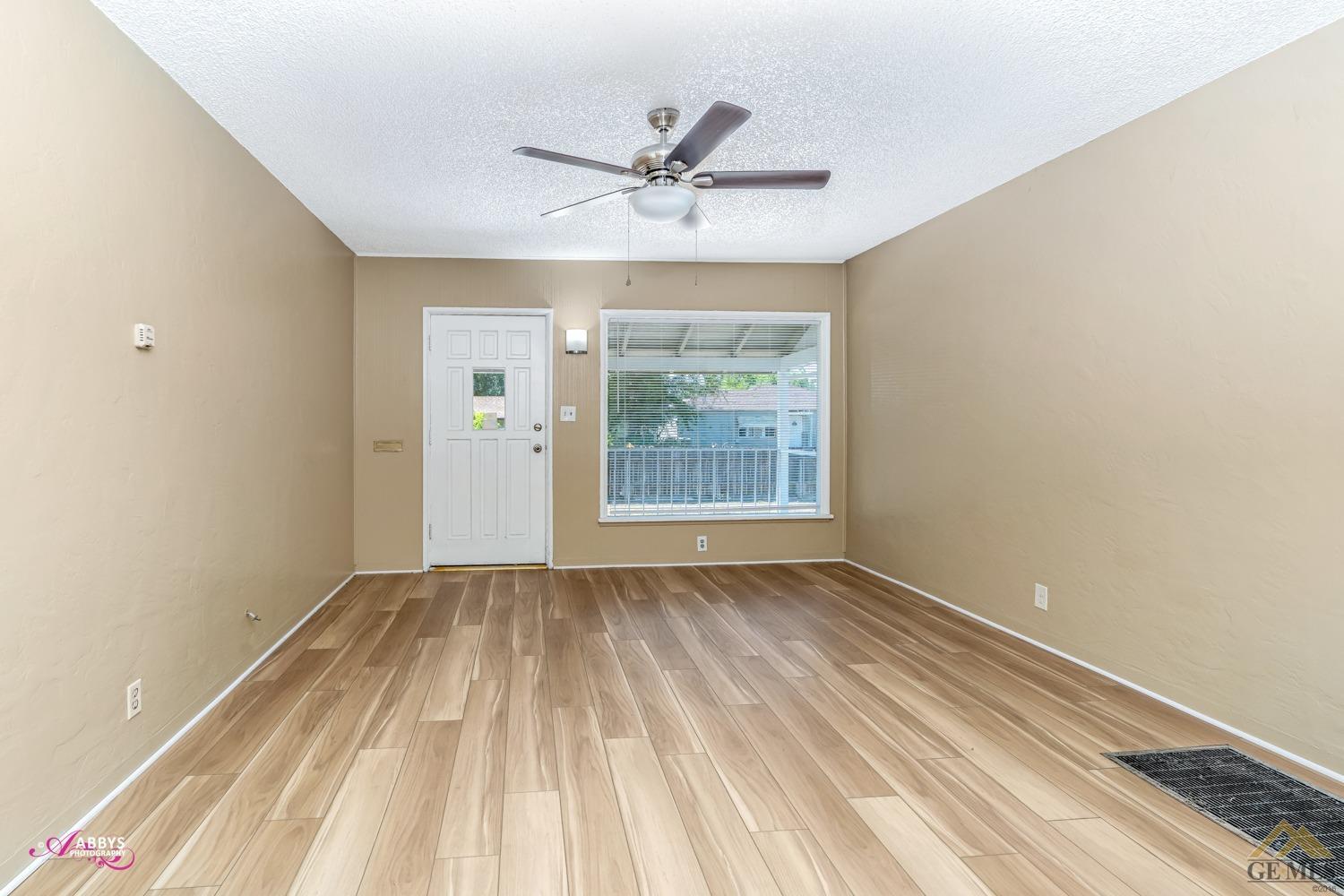 Undisclosed Address Bakersfield, CA 93308 - Photo 10 of 37 a view of a livingroom with a ceiling fan and window