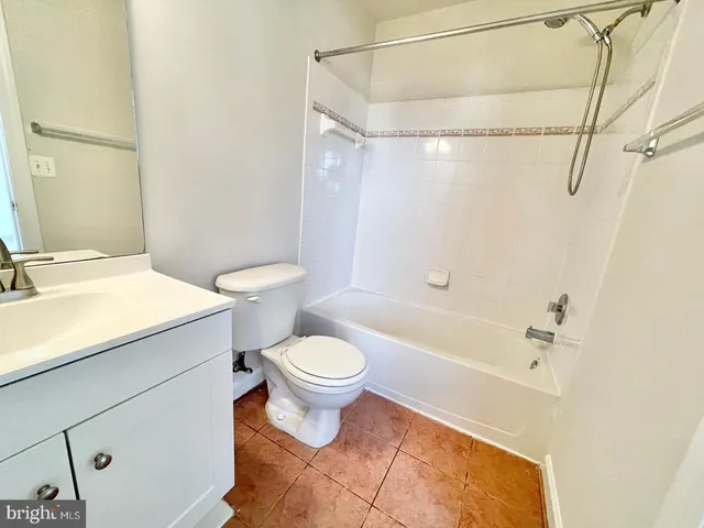a bathroom with a toilet a sink and a bathtub