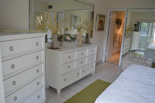 a bathroom with a double vanity sink a mirror and a shower