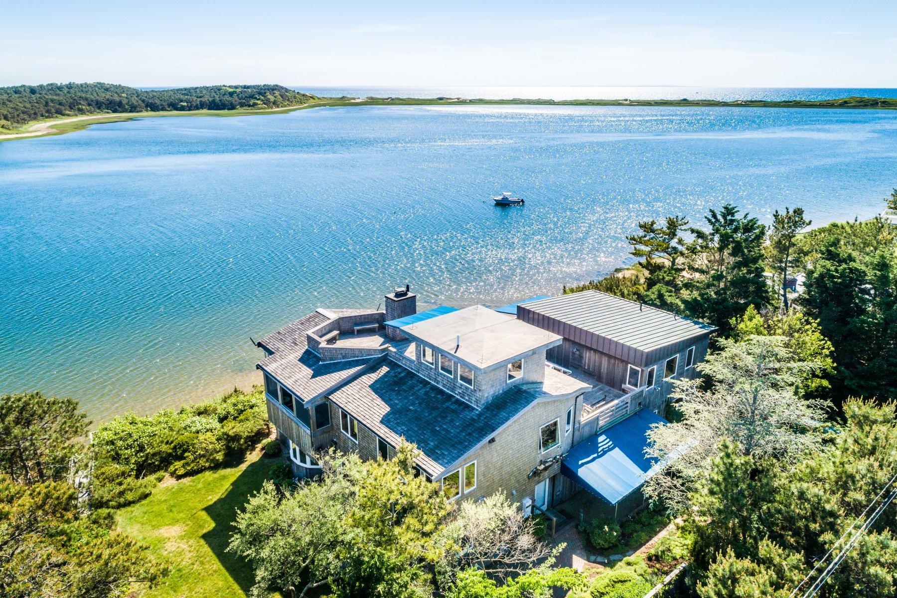 925 Chequessett Neck Road Wellfleet, MA 02667 - Photo 1 of 47 an aerial view of a house with outdoor space and lake view