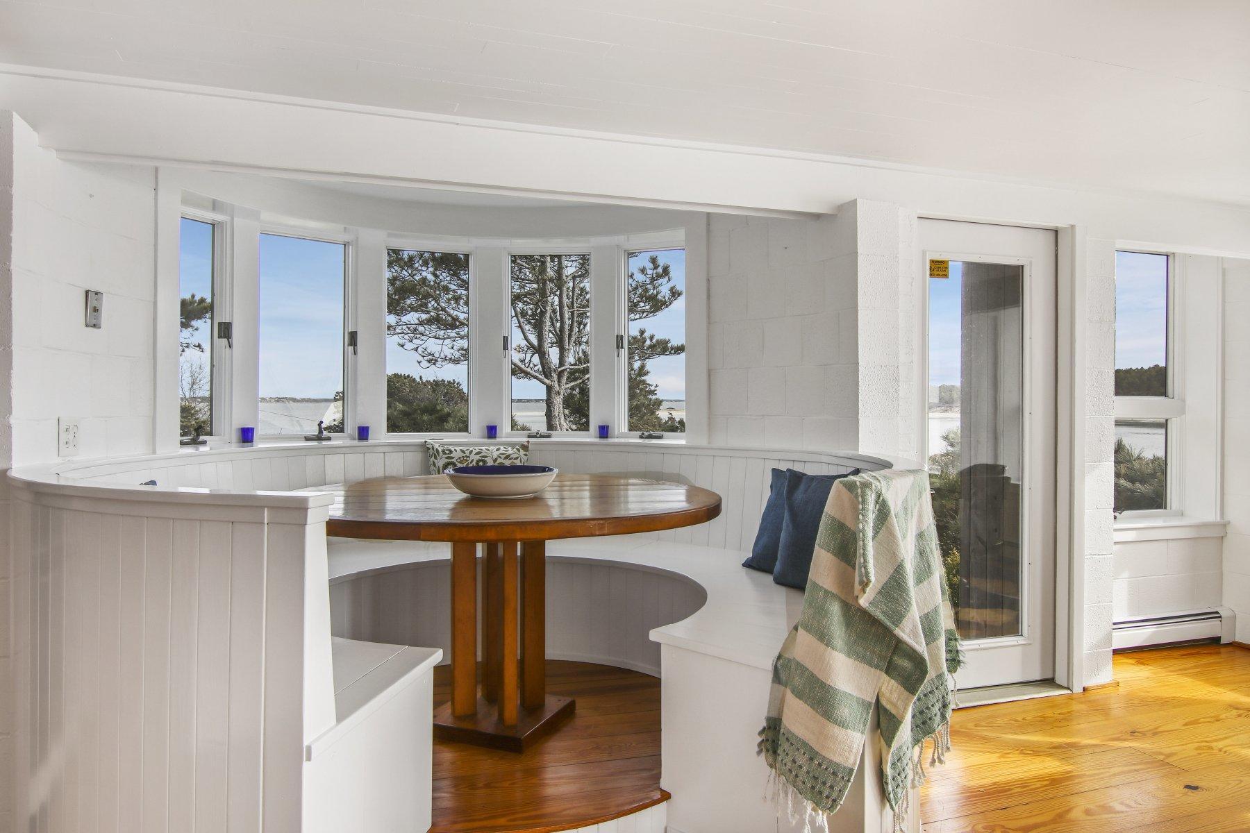 925 Chequessett Neck Road Wellfleet, MA 02667 - Photo 16 of 47 a kitchen with stainless steel appliances kitchen island granite countertop a sink and cabinets