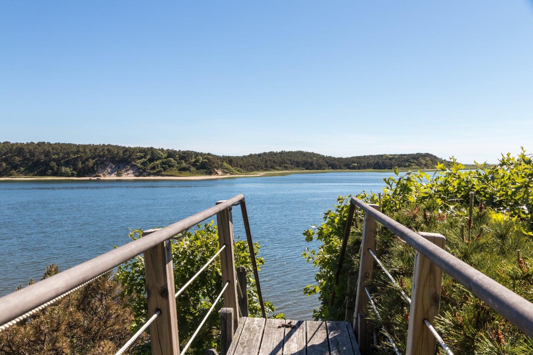 925 Chequessett Neck Road Wellfleet, MA 02667 - Photo 21 of 47 a view of a balcony with an ocean