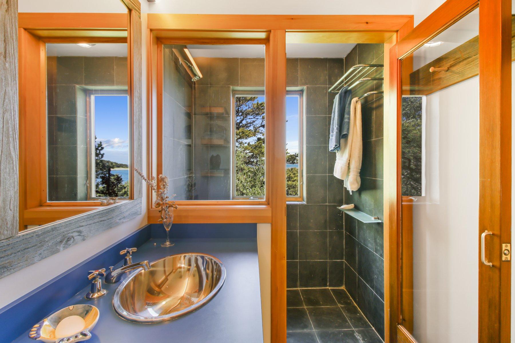 925 Chequessett Neck Road Wellfleet, MA 02667 - Photo 28 of 47 a bathroom with a tub and shower