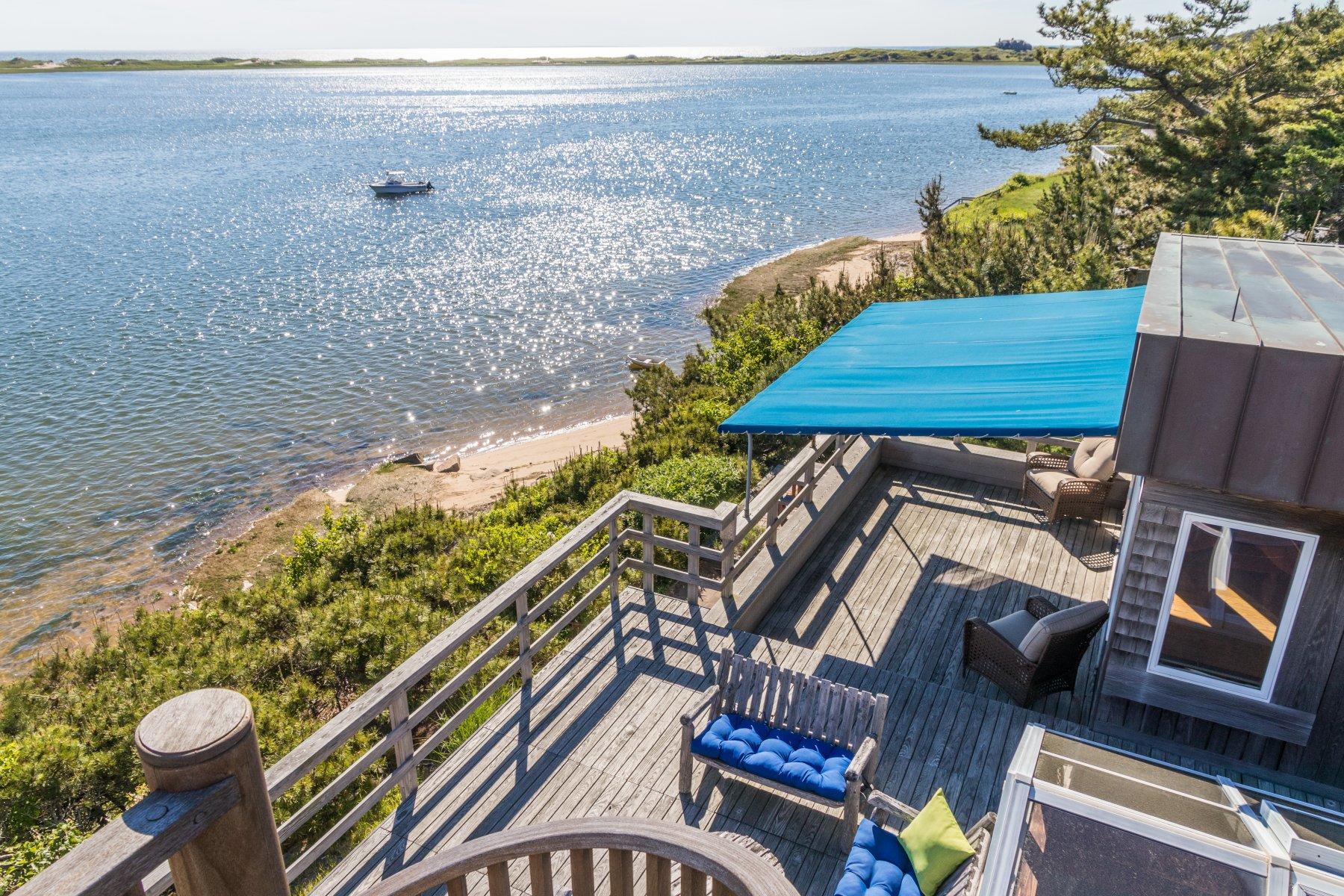 925 Chequessett Neck Road Wellfleet, MA 02667 - Photo 29 of 47 a view of a balcony with chairs