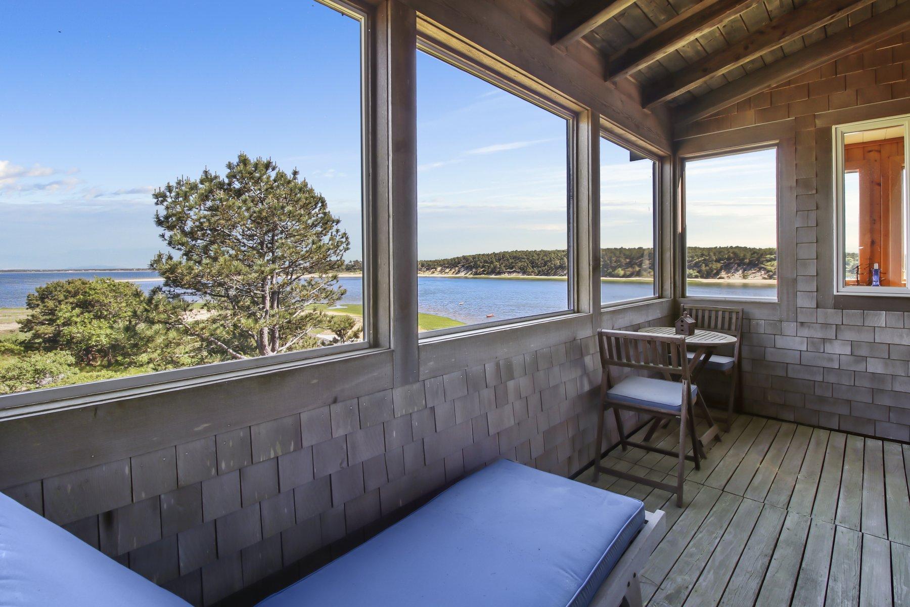 925 Chequessett Neck Road Wellfleet, MA 02667 - Photo 36 of 47 a balcony with chairs and wooden floor