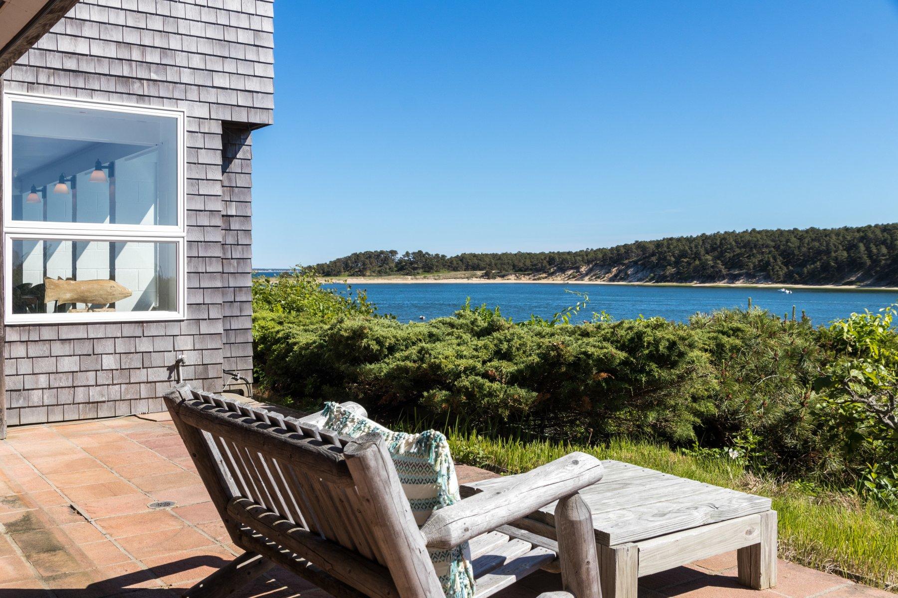 925 Chequessett Neck Road Wellfleet, MA 02667 - Photo 40 of 47 a view of a balcony with two chairs