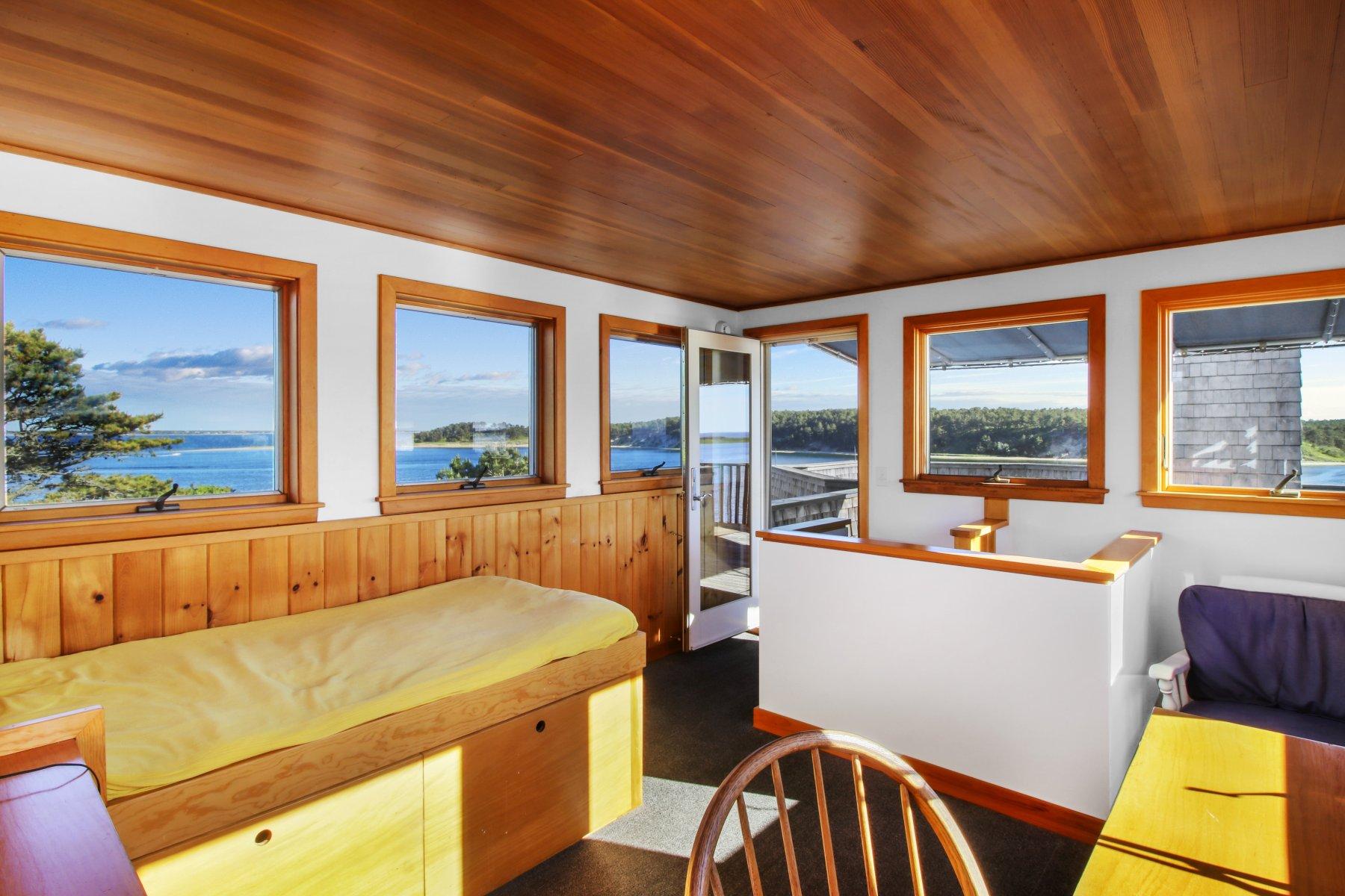 925 Chequessett Neck Road Wellfleet, MA 02667 - Photo 43 of 47 a room with furniture and window