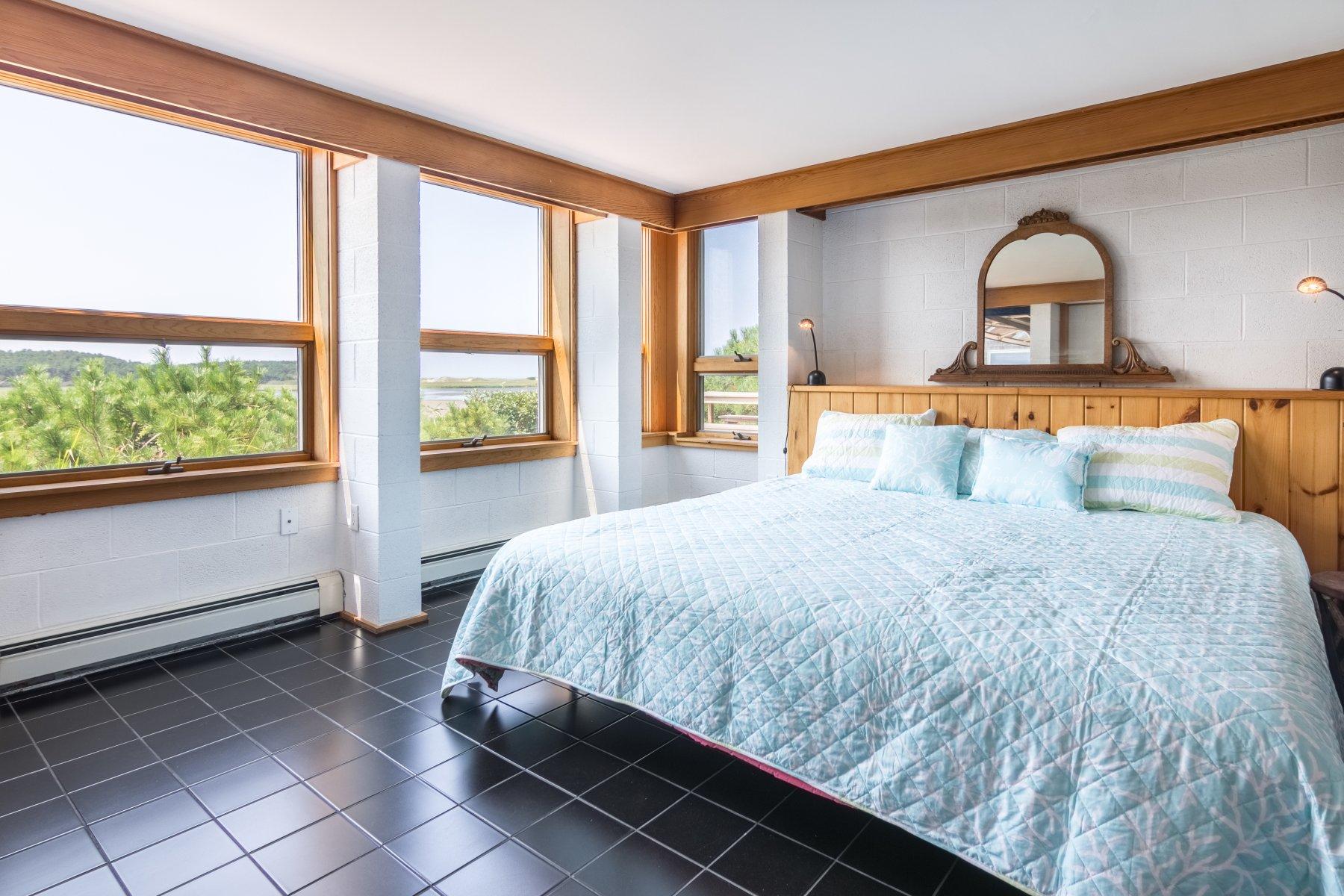 925 Chequessett Neck Road Wellfleet, MA 02667 - Photo 45 of 47 a bedroom with a bed and window