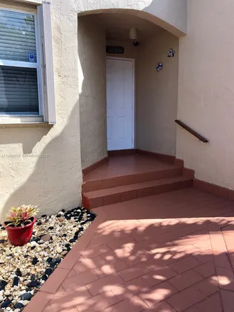 a view of a porch with a bench